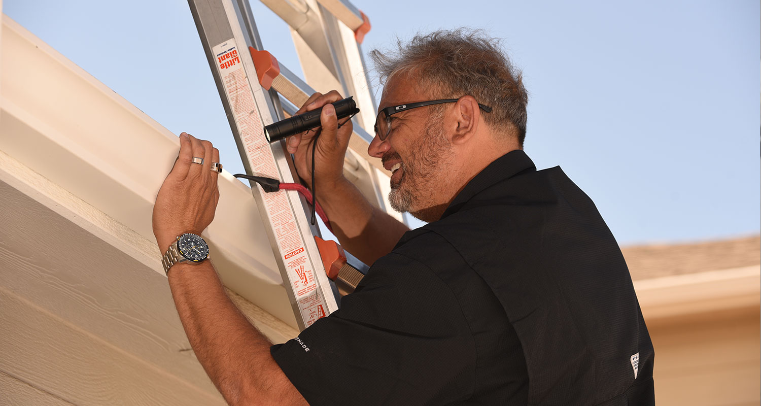 Lance inspecting the outside of a home in colorado springs